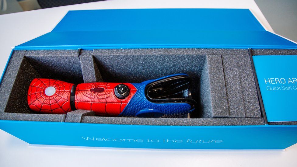 The 3D-printed bionic Spider-Man arm in a box