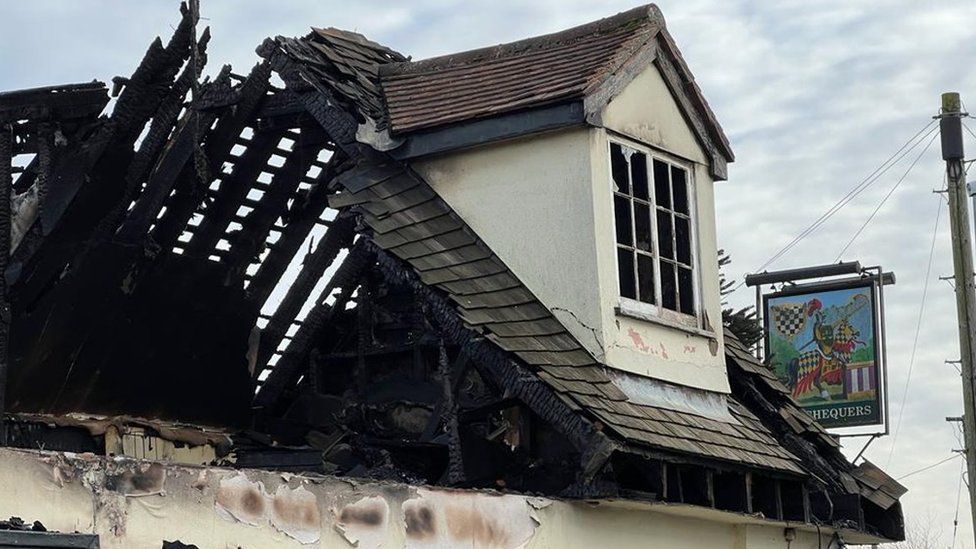 The Chequers pub after a fire