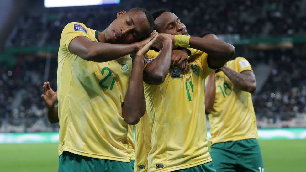 South African players are celebrating after scoring during the international friendly football match between Algeria and South Africa in Algiers, Algeria, on March 26, 2024.