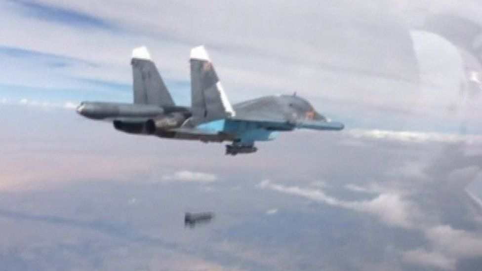 A frame grab taken from footage released by Russia's defence ministry shows a Russian Su-34 fighter-bomber dropping a bomb in the air over Syria (09 October 2015)