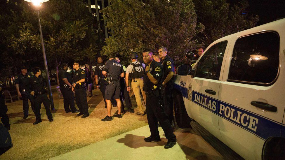 Police cars sit on Main Street in Dallas following the sniper shooting during a protes