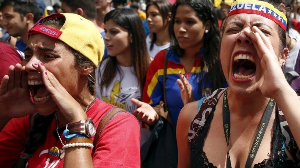 Opposition students shout slogans while they take part in a rally against President Nicolas Maduro"s government on University Student Day, in Caracas, November 21, 2015.