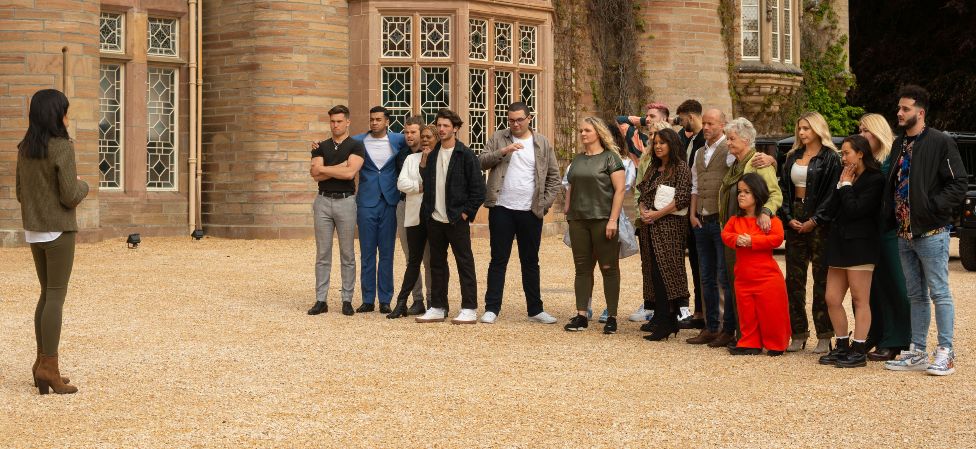 Claudia Winkleman with the contestants of The Traitors
