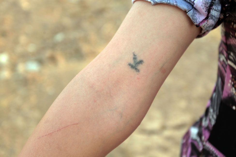 Shaima was tattooed by her captors
