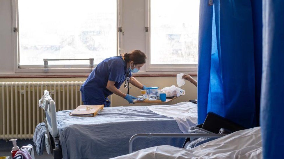 A general view of a member of staff on a NHS hospital ward