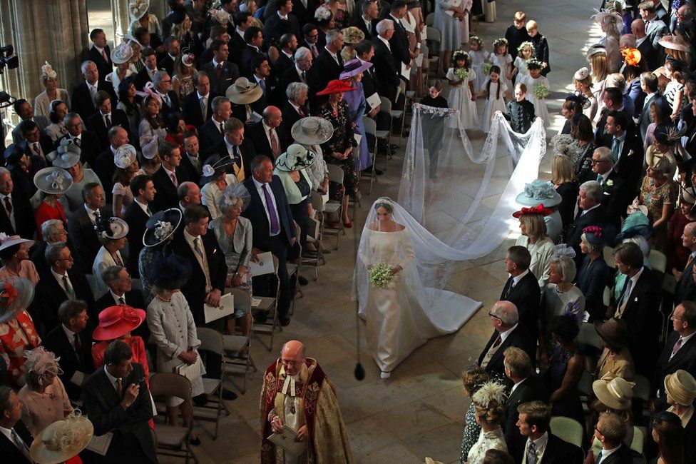 Meghan Markle walks down the aisle as she arrives in St George's Chapel at Windsor Castle