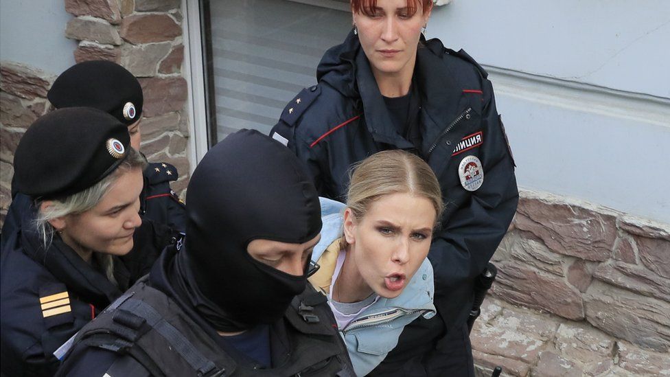 Law enforcement officers detain Russian opposition figure Lyubov Sobol near her office in Moscow