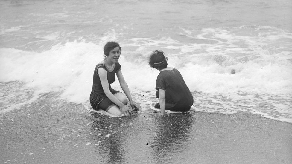 Two friends on the beach at Aberystwyth wearing Victorian swimming costumes on 18 August 1916