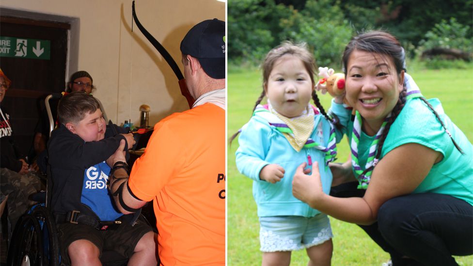A boy in a wheelchair doing archery and a girl and woman