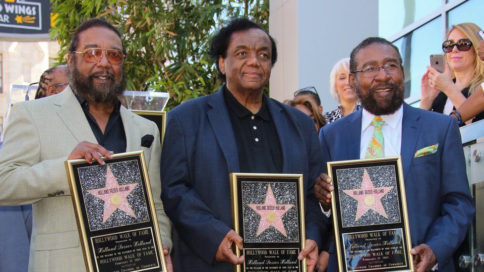 Dozier flanked by the Holland brothers as they received their star on the Hollywood Walk Of Fame in 2015