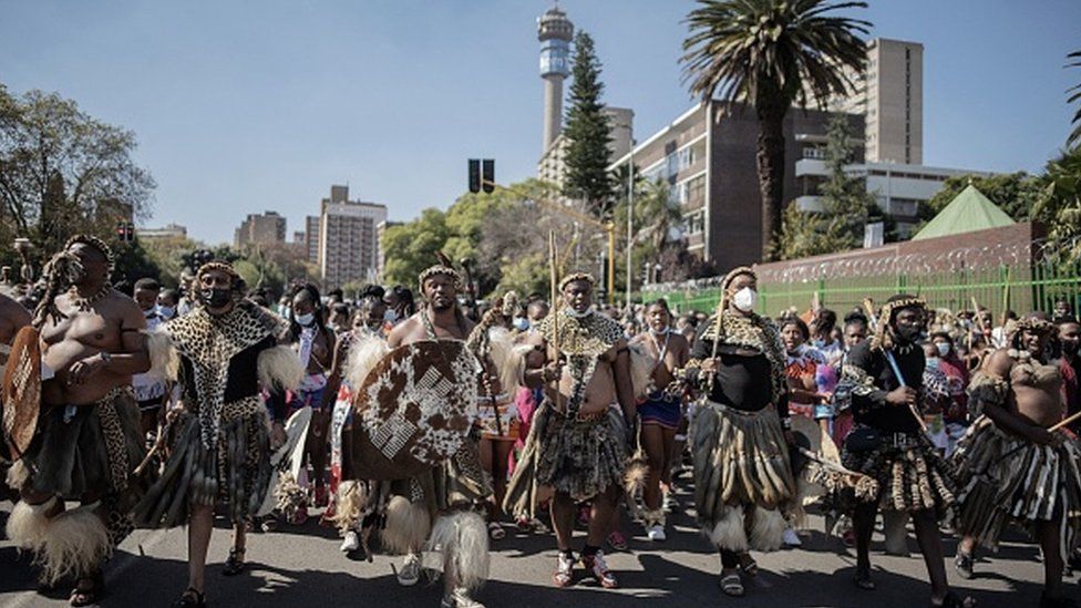 More than 200 Zulu traditionally dressed people parade through the streets in Johannesburg