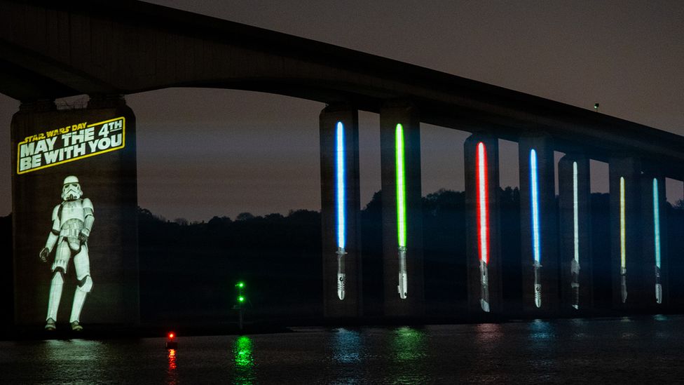 A Stormtropper and lightsabers projected onto Orwell Bridge, Suffolk