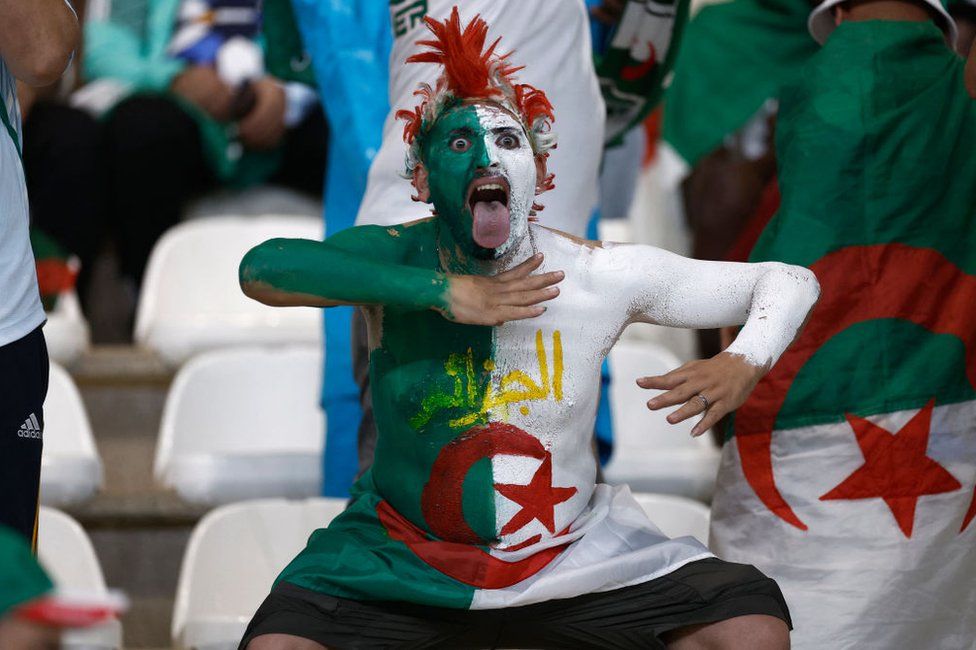 An Algeria supporter gestures ahead of the Africa Cup of Nations group D football match between Algeria and Angola at Stade de la Paix in Bouake.