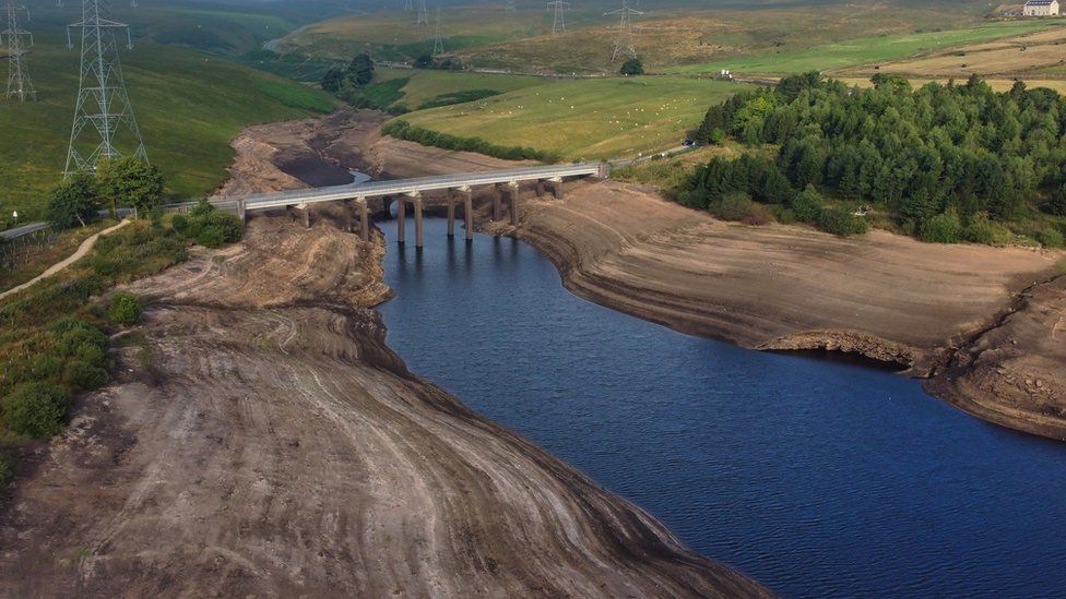 Aerial view of low water levels at Baitings reservoir, Ripponden, West Yorkshire, England, Britain