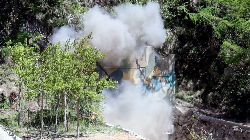 Smoke emerges from a tunnel demolition at Punggye-ri