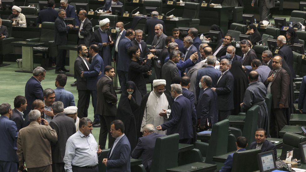 Iranian Parliamentarians gather for a parliament session in Tehran on October 4, 2022