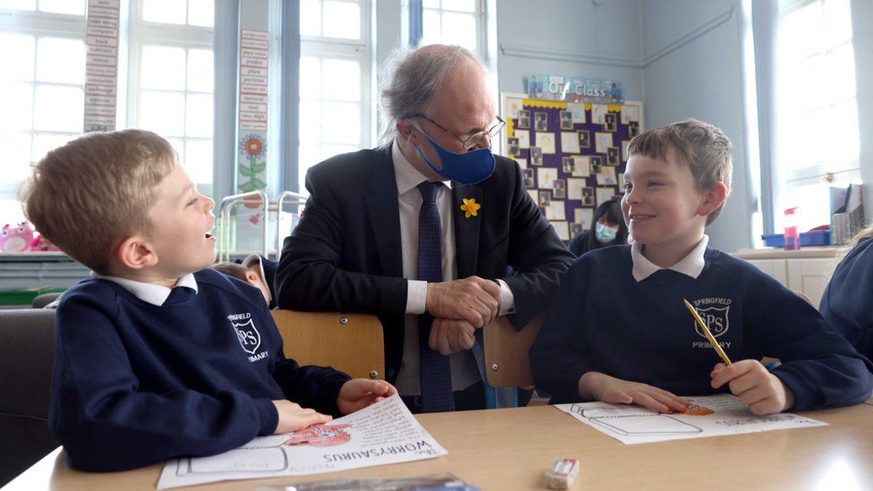 Education Minister Peter Weir in a classroom with two schoolboys