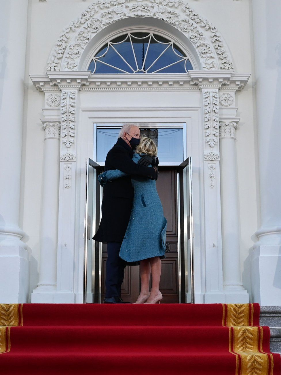 President Joe Biden and First Lady Dr Jill Biden embrace outside the White House