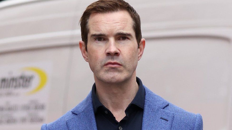 Jimmy Carr: Protesters gather outside Cambridge show - BBC News