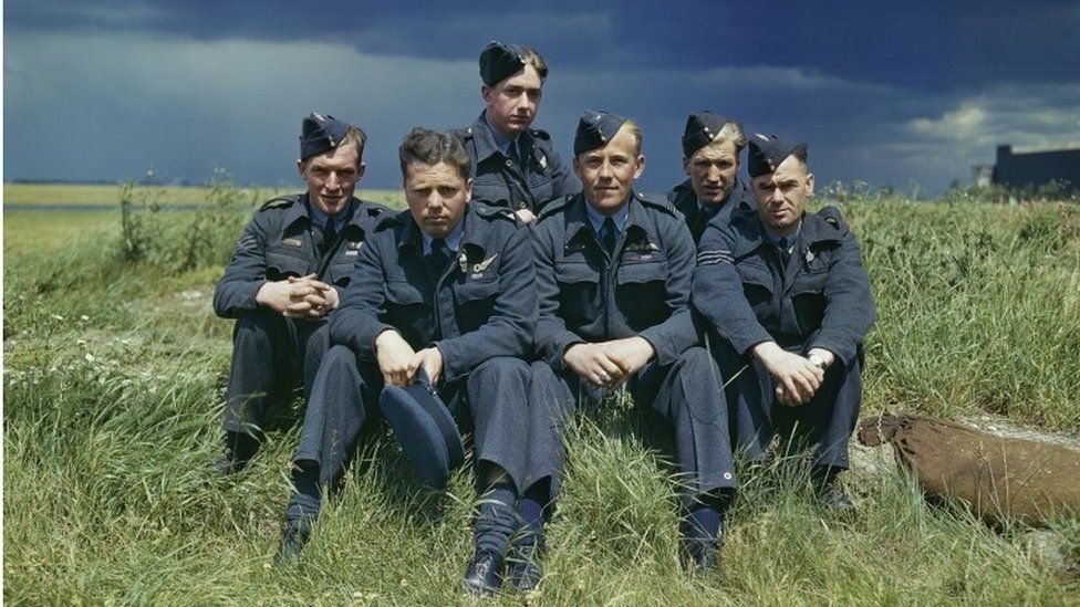 Left to right: Sergeant G Johnson; Pilot Officer D A MacLean, navigator; Flight Lieutenant J C McCarthy, pilot; Sergeant L Eaton, gunner. In the rear are Sergeant R Batson, gunner; and Sergeant W G Ratcliffe, engineer