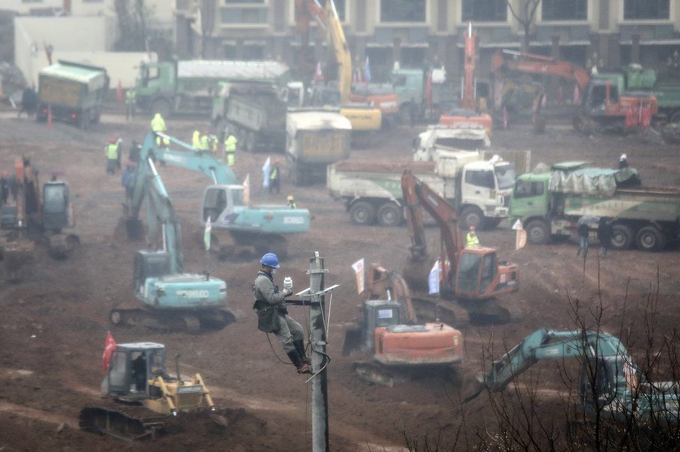 A view of cranes and diggers building Huoshenshan Hospital