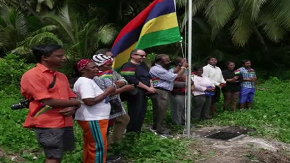 The Mauritian flag being raised