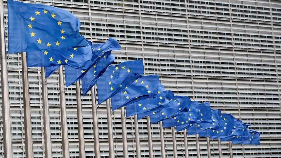 European Union flags flutter outside the EU Commission headquarters in Brussels,