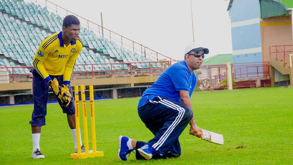 Ganesh Singh bats while kneeling on the ground