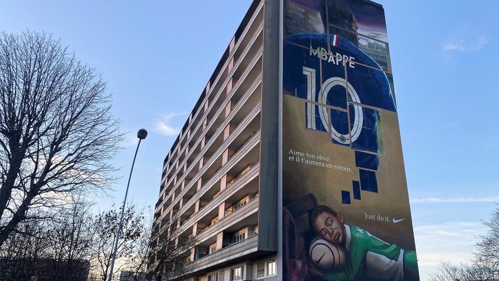 A mural of Kylian Mbappe in the Paris suburbs