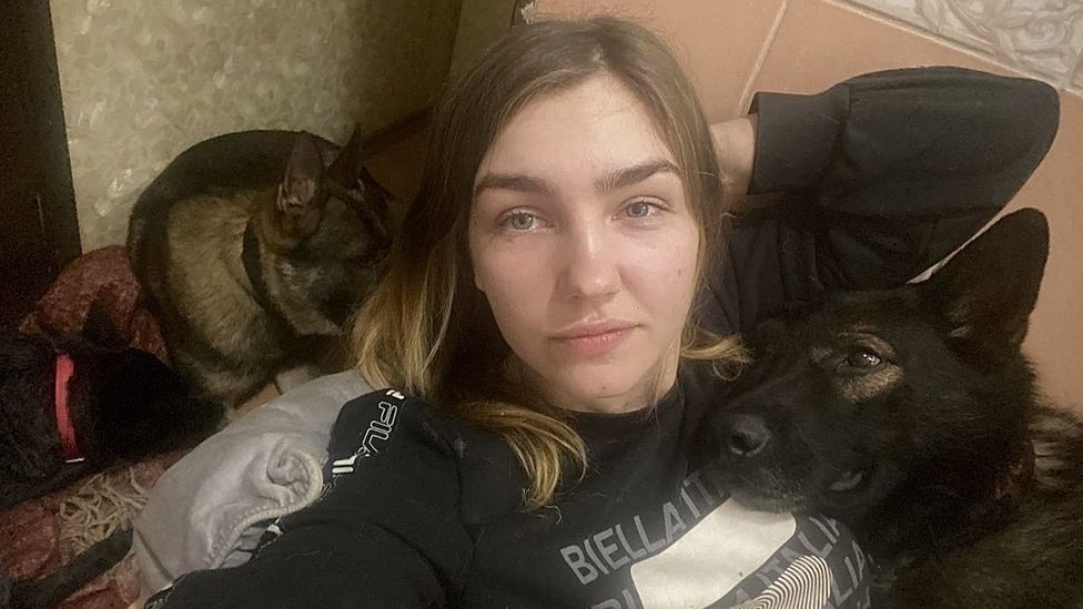 Oleksandra sheltering with her dogs in her flat's bathroom in Kharkiv