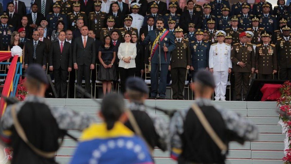 Venezuela's President Nicolas Maduro (C) speaks during a military parade in Maracay, Venezuela, November 27, 2017.