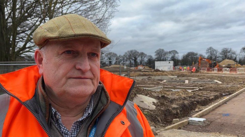 Councillor Alistair Beales stands on the edge of the Florence Fields development off Parkway in King's Lynn.