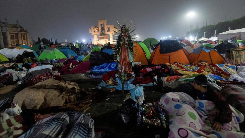 Pilgrims sleep in the square of the Basilica of Our Lady of Guadalupe during the annual Virgin of Guadalupe feast day, in Mexico City, Mexico, December 12, 2023.