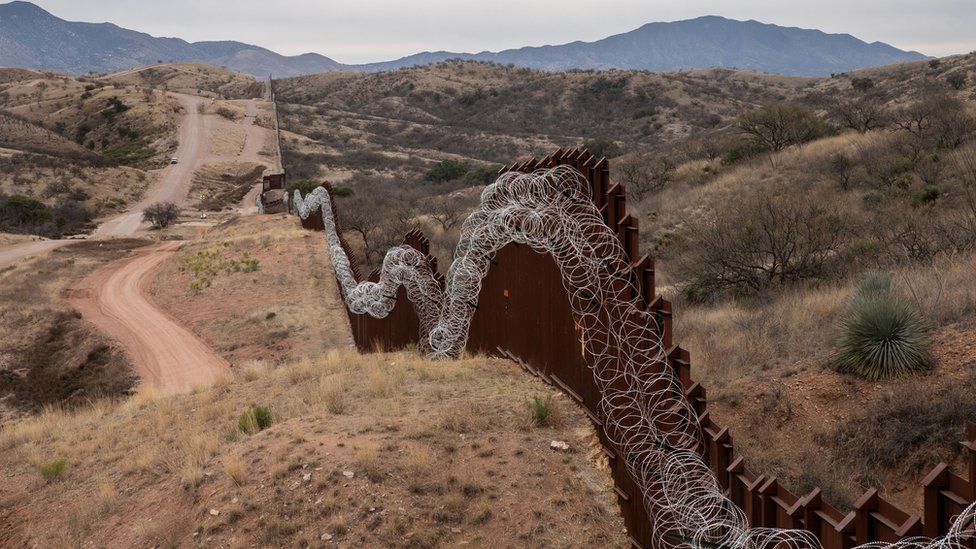 The US border fence, covered in concertina wire, separating the US and Mexico, at the outskirts of Nogales, Arizona, on February 9, 2019