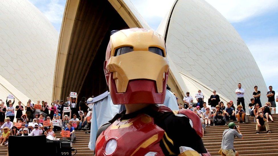 Iron Boy strikes a pose in front of the Opera House