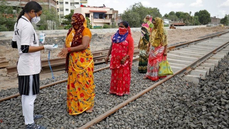 A healthcare worker checks oxygen levels of local women near Ahmedabad, India. Photo: 15 September 2020
