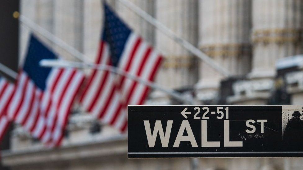 A Wall Street sign outside the New York Stock Exchange.