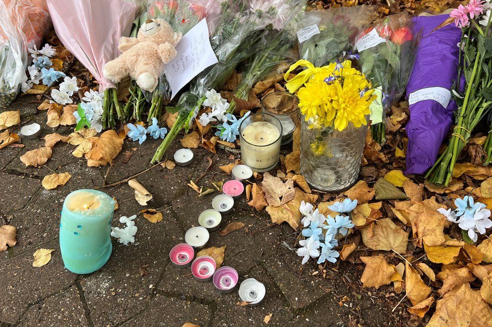 Flowers near police search at Loxbeare Drive in Furzton, Milton Keynes