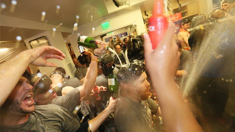 Houston Astros celebrate in the clubhouse