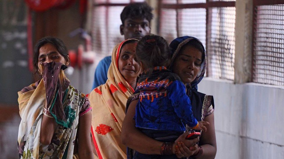 Indian relatives mourn the death of their children at the Baba Raghav Das Hospital in Gorakhpur.