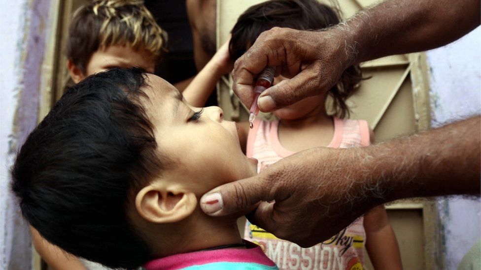 Administering the polio vaccine in Karachi, Pakistan