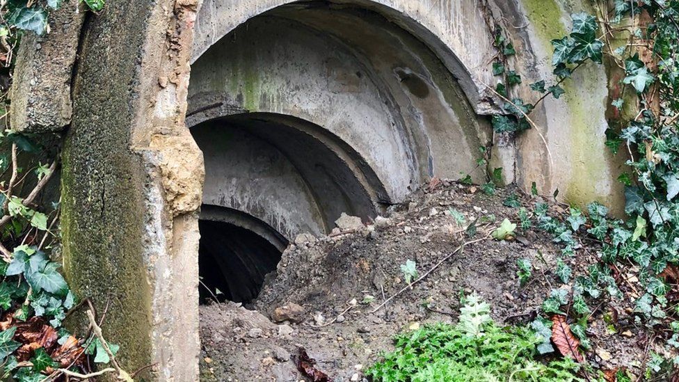 The air raid shelter, with mud a rubble piled outside, that was discovered by pupils