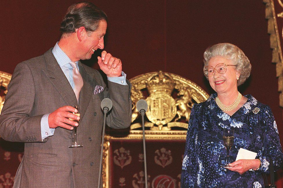 Prince of Wales smiling at his mother Queen Elizabeth II