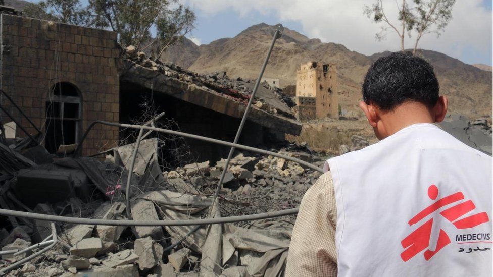 A member of MSF's medical staff looks at the ruins of a hospital in Haydan, Yemen