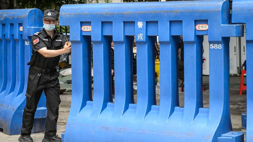 A barrier is removed in an area of Guangzhou in Guangdong province