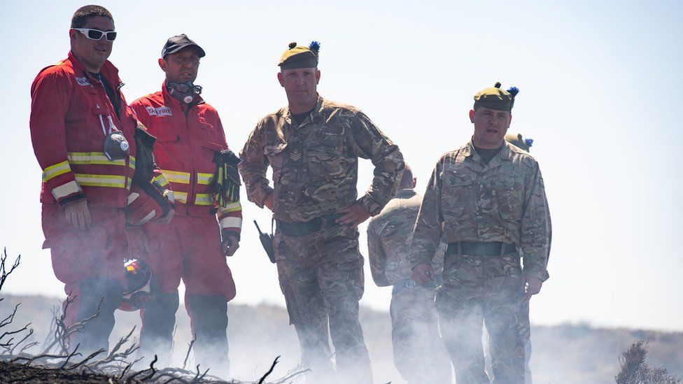 Soldiers and firefighters on Saddleworth Moor