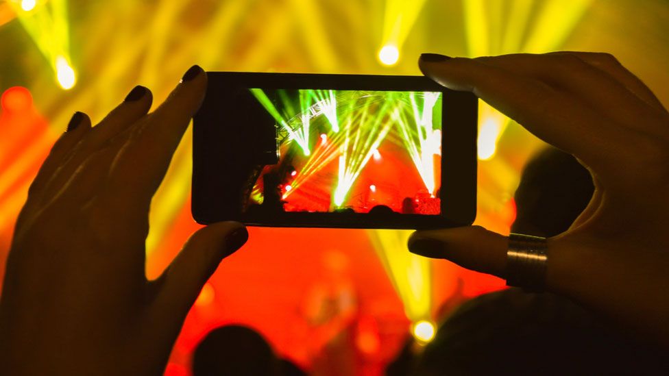 A smartphone at a gig