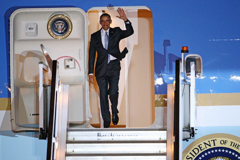 Obama coming out of Air Force One