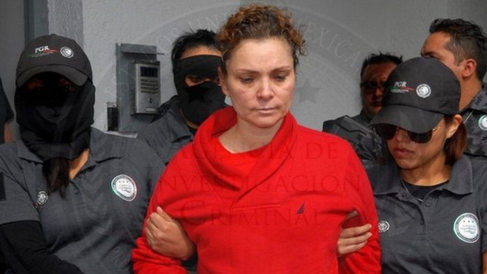 Maria de los Angeles Pineda (C), wife of former Mayor of Iguala, Jose Luis Abarca and allegedly connected to the case of forced disappearance of the 23 students on September 2014, guarded by Mexican authorities in Mexico City, Mexico, 12 January 2014.