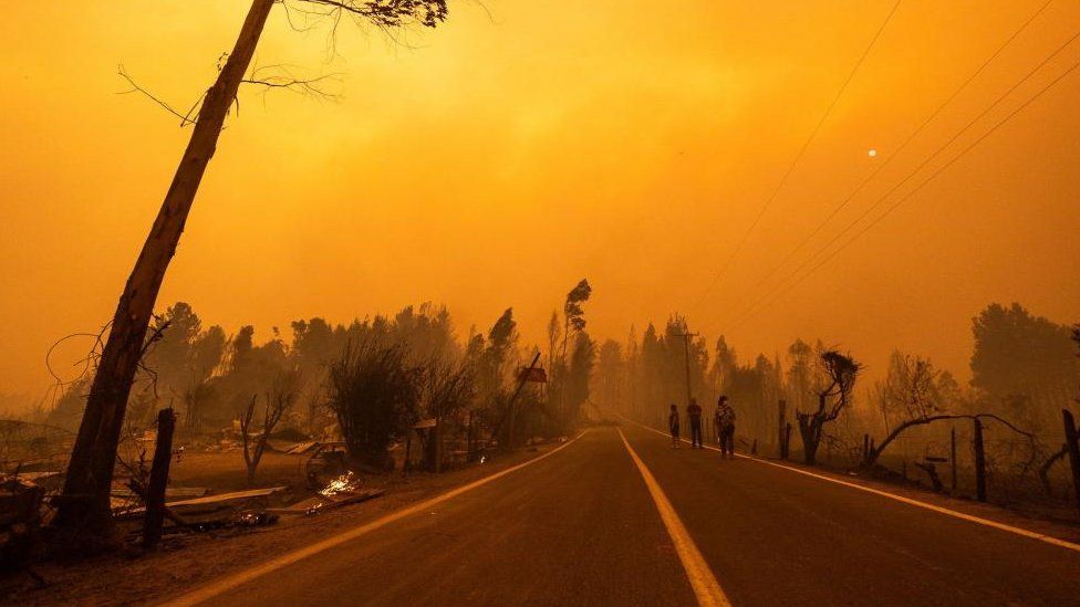 A view on a yellow sky and smoke during a wild fire near the city of Santa Juana, Chile, 03 February 2023 (Issued 04 February 2023).